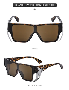 Detail of tortoise shell sunglasses with silver metal horn accents and brown lenses