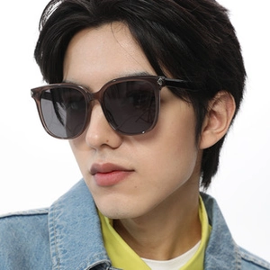 Close-up of square polarized sunglasses with translucent grey frame and silver metal accents