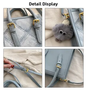 Detail showing faux denim texture, gold buckle hardware and cute plush monster charm