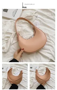 Pink crescent shoulder bag in smooth PU leather with multiple angle views and strap detail