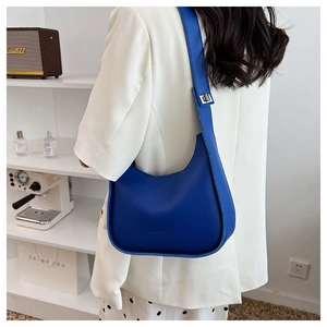 Klein blue half-moon saddle bag made of matte leather with adjustable shoulder strap