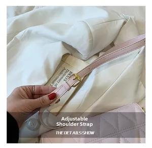 Detail of adjustable strap with gold buckle on light pink quilted crossbody bag
