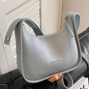 Chic light blue leather hobo crossbody bag with adjustable wide strap and zip closure