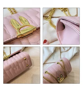 Detail of pink quilted handbag with gold rabbit-ear twist lock and chain strap