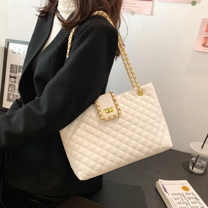 Elegant white quilted tote bag with gold chain strap and turn-lock for women's daily commute