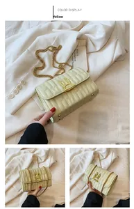 Detail of yellow quilted crossbody bag with golden rabbit ear buckle and chain strap
