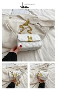 Close-up of white quilted bag featuring golden chain strap and rabbit ear clasp detail