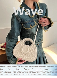 Detail of cream white wavy quilted handbag showing premium texture and shoulder strap