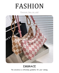 Detail of plaid fabric shoulder bags with knot straps and classic diamond pattern