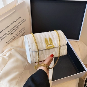 Elegant white quilted chain bag with rabbit ear buckle and gold strap for women