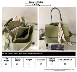 Size chart and interior storage details for the minimalist green faux leather handbag