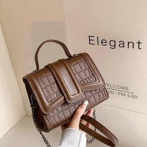 Elegant brown crocodile pattern crossbody bag with a metal chain strap and top handle