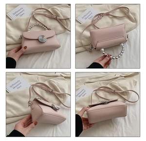 Detailed views of light pink mini crossbody bag with pearl handle and silver clasp