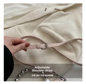 Detail of pink adjustable shoulder strap with silver buckle and fine stitching