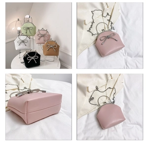 Detail of elegant bow evening bag with diamond embellishment in five colors