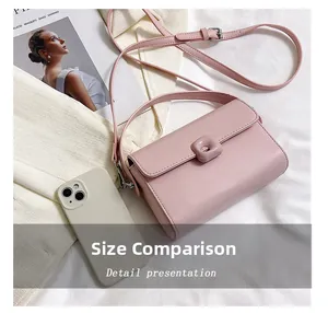Pink minimalist crossbody bag size comparison with a smartphone on white fabric
