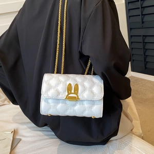Quilted white crossbody bag with gold bunny ears lock and metal chain strap