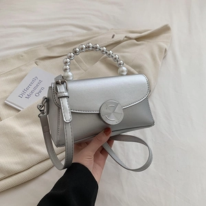 Silver high-fashion mini crossbody bag with pearl beaded handle and metal spiral lock