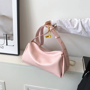 Pink PU leather shoulder bag with wide adjustable strap and golden zip closure