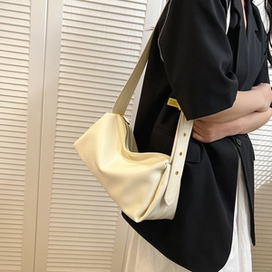 Chic cream leather underarm bag with pleated design and wide adjustable strap