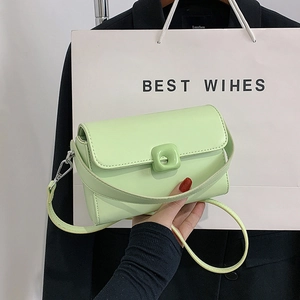 Vintage mint green square crossbody bag with smooth leather finish and decorative buckle
