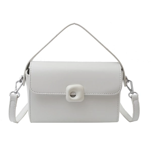 Minimalist white square crossbody bag with top handle and silver metal buckle detail