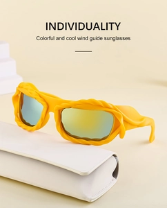 Detail of yellow Y2K wavy frame sunglasses with green mirror lenses and a white case