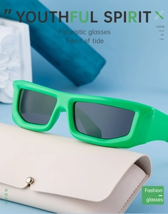 Neon green futuristic Y2K cycling sunglasses with cream leather case on blue background