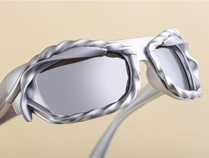 Detailed close-up of matte silver twisted metal frame on fashion Y2K sunglasses