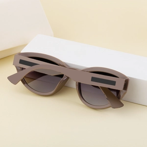 Macro view of gradient grey lenses and thick brown resin frame on stylish sunglasses