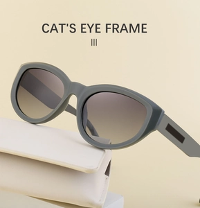 Detailed view of matte cat eye sunglasses with gradient lenses and white leather case