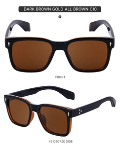 Détail de lunettes de soleil marron foncé avec rivets étoiles et finitions dorées
