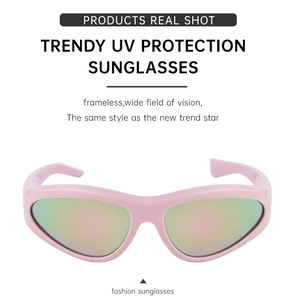 Detail view of pink Y2K futuristic sunglasses with wrap-around rainbow mirrored lenses
