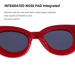 Détail de lunettes de soleil rouges avec plaquettes de nez intégrées pour le confort