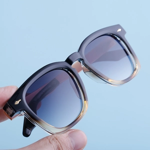 Detail view of the square frame sunglasses temple showing model number ZS98160 and lens size