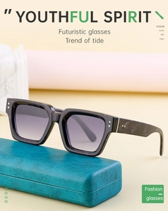 Detail of square black sunglasses with marble texture temples and a green leather case