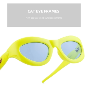 Detail of neon yellow cat eye sunglasses with light blue lenses and stylish thick frames