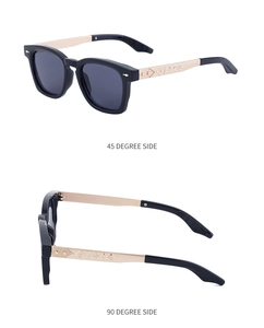 Detail view of square sunglasses with engraved gold metal temples and star motifs