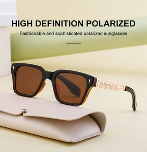 Detail of gold metal temples with embossed floral patterns on polarized sunglasses
