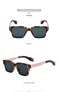 Macro detail of tortoiseshell sunglasses with golden embossed temples and green polarized lenses