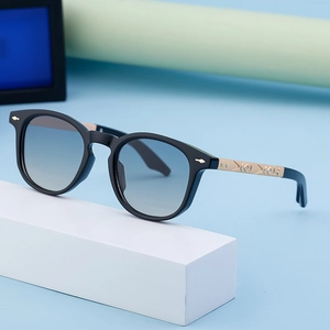 Fashionable square sunglasses with gradient blue lenses and gold engraved temples