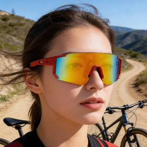Outdoor cycling sunglasses on female model with colorful gradient lenses and red frame