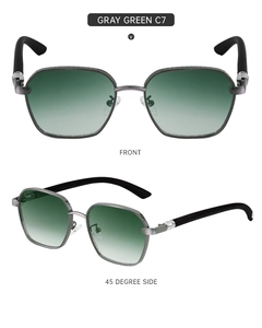 Detail of vintage square sunglasses with gray-green lenses and silver cross hinge design