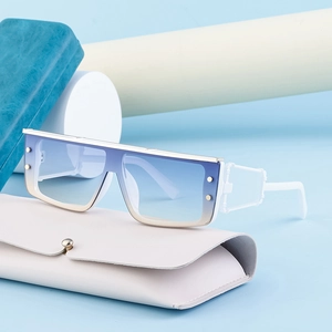 Close-up of cyberpunk square sunglasses with gradient lenses and a leather case