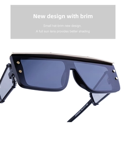 Detail view of steampunk square sunglasses with visor design and gold metallic rivets