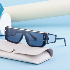 Cyberpunk steampunk rectangle sunglasses with blue lens and gold metal trim and rivets