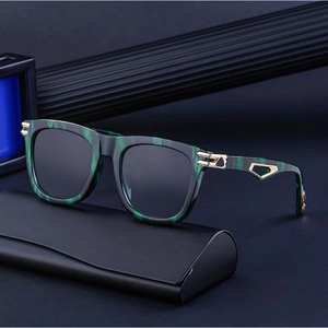 Detail of square green marble texture sunglasses frame with gold metal temple accent