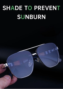 Detail view of rimless aviator sunglasses with silver metal frame and blue gradient lenses