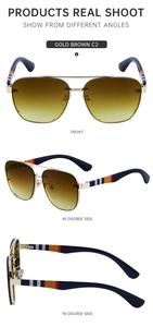 Detail view of gold rimless sunglasses with gradient brown lenses and striped temples