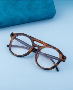 Detail of vintage leopard print round eyewear frames with a stylish double bridge design